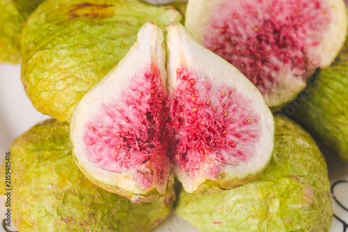 Canvastavla Fresh Xinjiang Figs Cut Open Showing Pink Flesh - Healthy Organic Fruit Display
