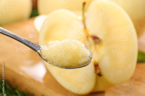 Fresh Golden Fuji Apple Slices with Creamy Applesauce on Spoon - Healthy Natural Fruit Snack