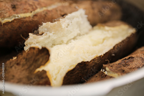 фотографія Freshly Dug Yam Tubers from Yunnan Plateau Farm Showing White Glutinous Flesh an