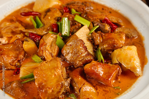 Wood-Fired Stewed Goose in Iron Pot - Traditional Chinese Hot Braised Poultry Dish with Vegetables