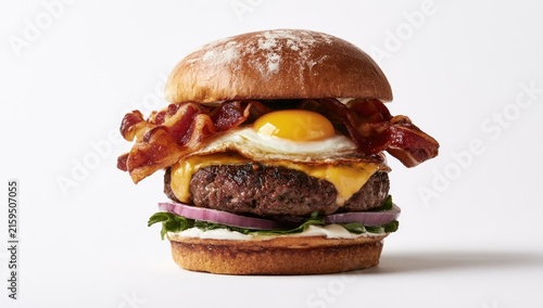 Naklejka Delicious Bacon Cheeseburger with Fried Egg and Fresh Toppings.