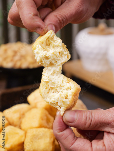 Bild auf Leinwand Deep Fried Bread Puffs Being Torn Apart Showing Fluffy Texture - Cooking Tips an