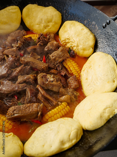 Obraz na płótnie Iron Pot Stewed Duck Casserole with Corn and Steamed Buns - Traditional Chinese