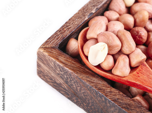 Bild auf Leinwand Fresh Raw Peanuts in Wooden Spoon on White Background Display Photo