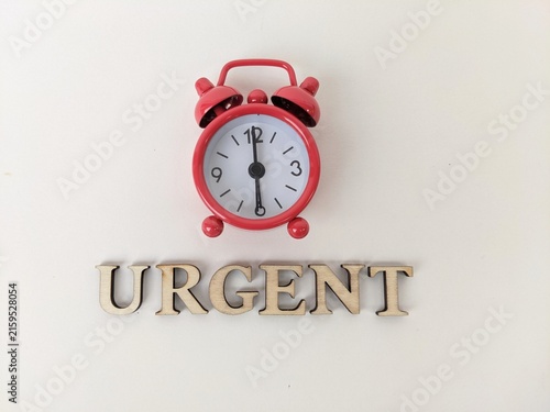 Urgent reminder symbolized by alarm clock, emphasizing immediate attention and critical importance. Business concept background, business object and metaphor.
