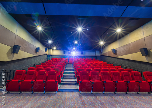 Fotografía Modern Cinema Theater with Red Seats and Projector Lights