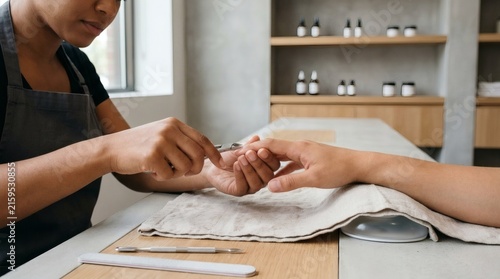 Manicurist Applying Nail Polish to Clients Nails in Spa Setting