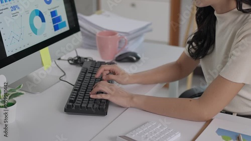 Businesswoman analyzing financial data on computer