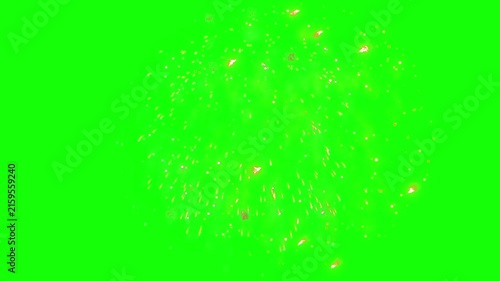 Golden sparks burst outward in a spherical explosion over a vibrant green screen chroma key background.
