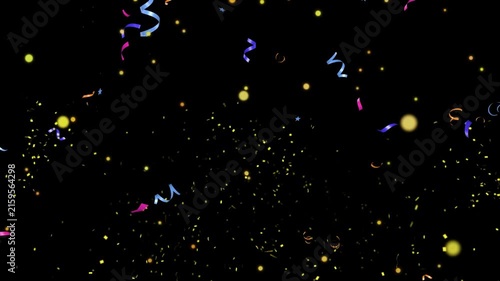 Confetti and metallic ribbons float dynamically across a dark black background during a vibrant festive event.