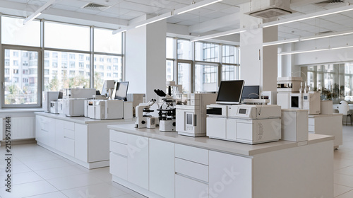 Organized Workstations and Scientific Instruments Fill a Modern White Lab