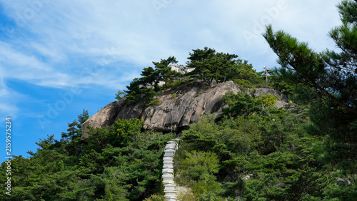 Hiking trail with stone steps ascending to the summit of Inwangsan Mountain in Seoul, South Korea