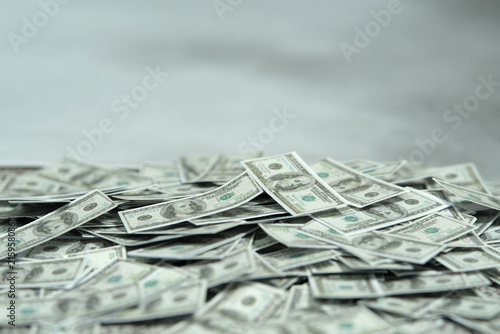 Pile of money with cloudy background. Dismal economics condition concept