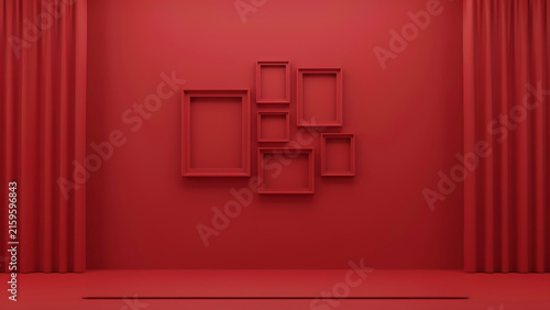 Collage of empty picture frames arranged on a monochrome red interior wall