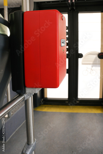 Cuadro en lienzo Red electronic ticket validator machine inside a modern public transport bus