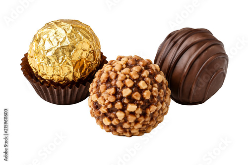 Assorted chocolate truffles with nuts and gold foil