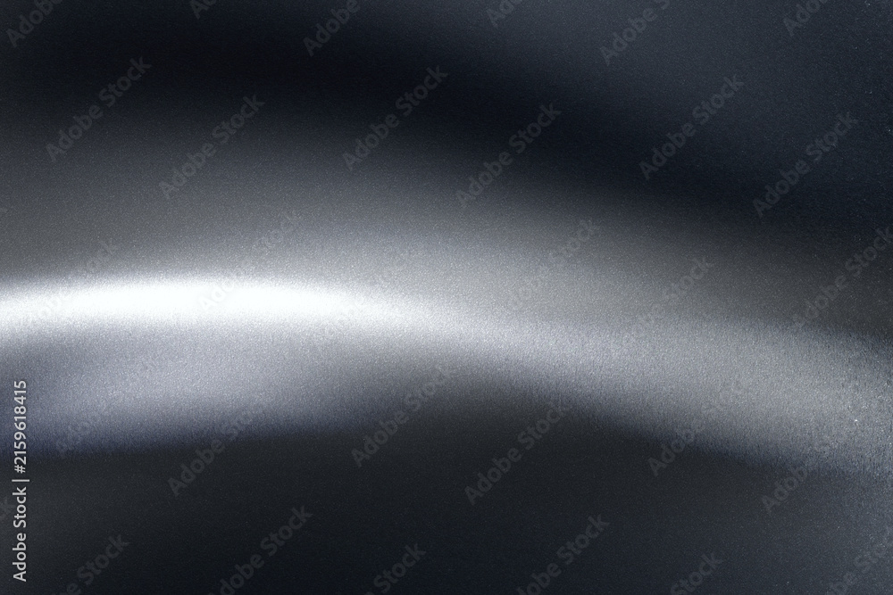 Fototapeta premium Abstract black metallic background with smooth shiny light wave reflection and fine grain texture, elegant modern backdrop for luxury covers and tech banners