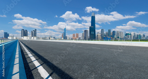 3d rendering empty urban highway leading to modern city skyline