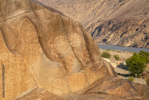 Closeup view of ancient petroglyphs on rock along historic silk road in Indus river valley, Chilas, Gilgit Baltistan, Pakistan