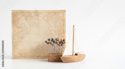 Vintage nautical map and wooden boat with colorful pins on white background