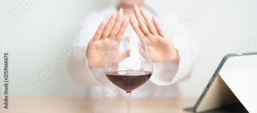 Фотография Doctor hand stop to refuse Wine, quitting drink for healthy liver, prevent Alcoh