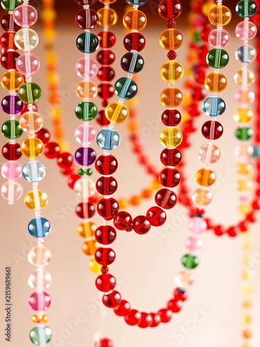 Colorful glass beads strung together to create festive garlands, ||beads, glass