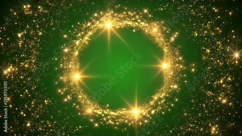 A circular frame made of golden sparkles and light flares on a green background.