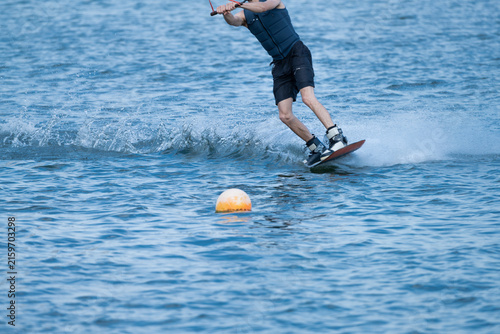 Wakeboarder Riding Through Water with Dynamic Splash