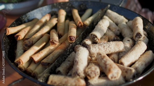 Street food at food festivals in Israel—a local celebration in Haifa. A close-up view of street food stalls featuring handmade goods, as well as small pastries and sweets.