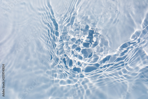 White water surface texture with caustic ripples under sunlight. Aqua background for summer vacation, beauty cosmetic and product display design.