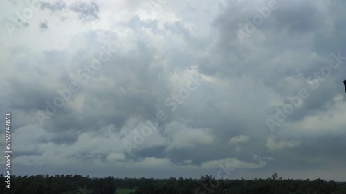 Dramatic Overcast Sky With Thick Storm Clouds Over A Forested Horizon Before Rain
