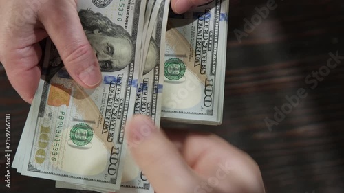 Woman's hand giving money to man close-up
