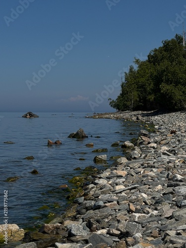 Konstfotografi Scenic view of a tranquil lake Baikal with gentle waves lapping against the shor