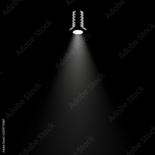 Spotlight beam shining in dark background