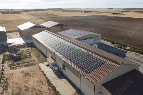 Farm buildings with solar panels generating renewable energy
