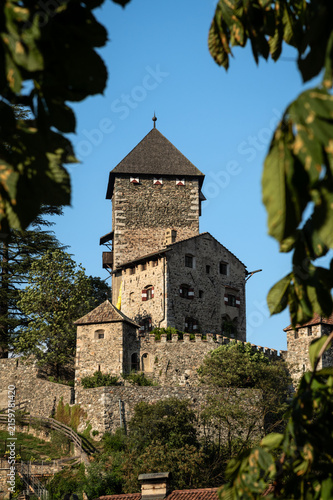 Konstfotografi Medieval Branzoll Castle Framed by Foliage in Chiusa - South Tyrol, Italy