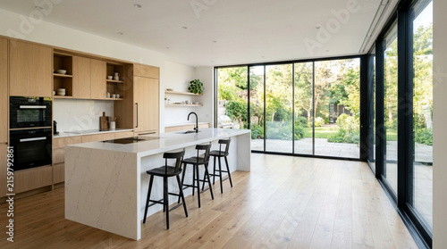 Modern Kitchen Design with Island, Natural Light, and Garden View