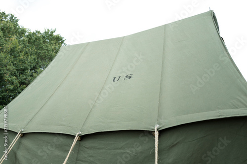 Konstfotografi Newly erected canvas US Army tent of the WW2 era showing the guying ropes and US stamp on the roof