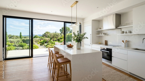 Modern kitchen island with garden view, interior design, natural light