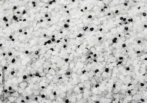 Close-up Macro View of White Granules with Black Specks.