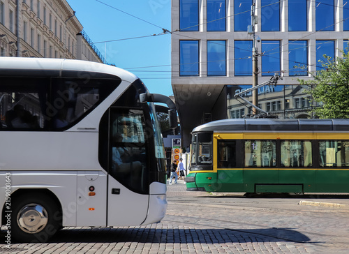 Canvas Print A Tram And A Tourist Bus Meet In The Hectic Capital Area