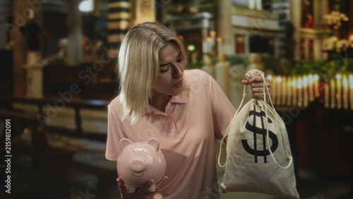 Foto Woman holding piggybank and money bag, lifting rope while inspecting coins in building; saving decision thoughtful