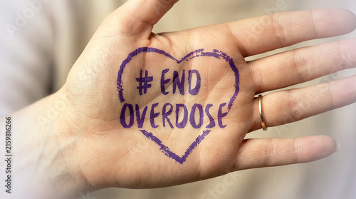 A poignant purple heart message on an open palm for overdose awareness day, symbolizing hope and advocacy to end the crisis and promote support and prevention efforts