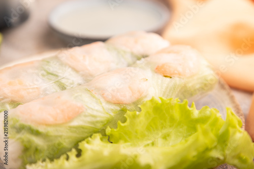Vietnamese shrimp spring rolls on brown concrete. side view, close up, selective focus