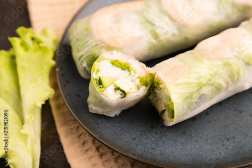 Vietnamese shrimp spring rolls on black concrete. side view, close up, selective focus