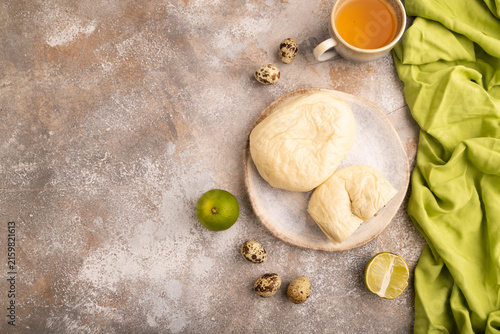 Vietnamese steamed buns Banh bao on brown concrete. top view, flat lay, copy space