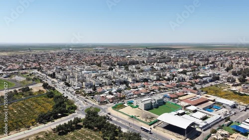 Aerial drone view of Ofakim city and industrial area in southern Israel with urban landscape and infrastructure