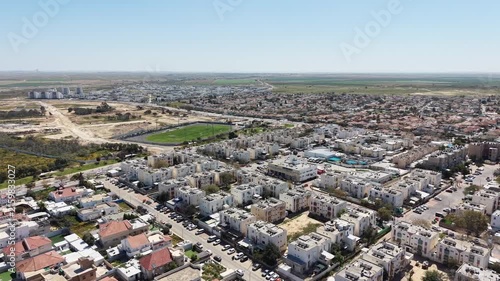 Aerial drone view of Ofakim city and industrial area in southern Israel with urban landscape and infrastructure