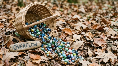 A wicker basket spills colorful marbles onto autumn leaves, representing playful nostalgia.