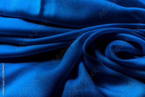 Photography Luxurious royal blue crepe silk cloth fabric texture with organic swirling folds